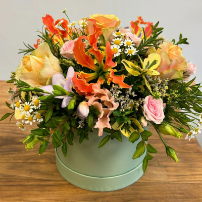 Simply The Best - A beautiful hat-box filled with a vibrant collection of flowers and foliage.